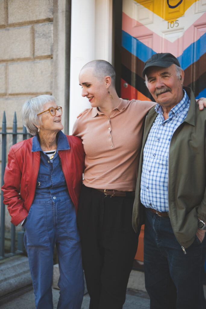 Annie Stands proudly with her mom and dad